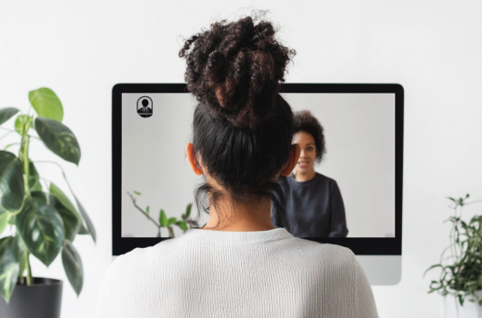 shamanistix_a_business_woman_on_a_zoom_call_with_one_person_on__2b7cde74-484a-4ae1-a162-e196a48154d0